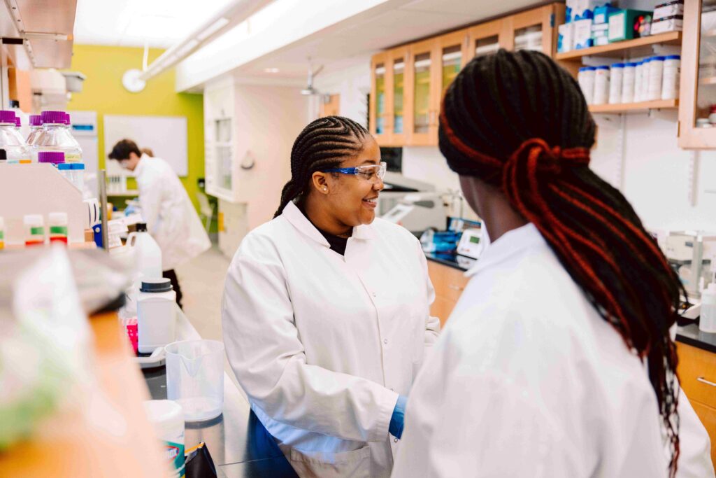 Two female students in lab.