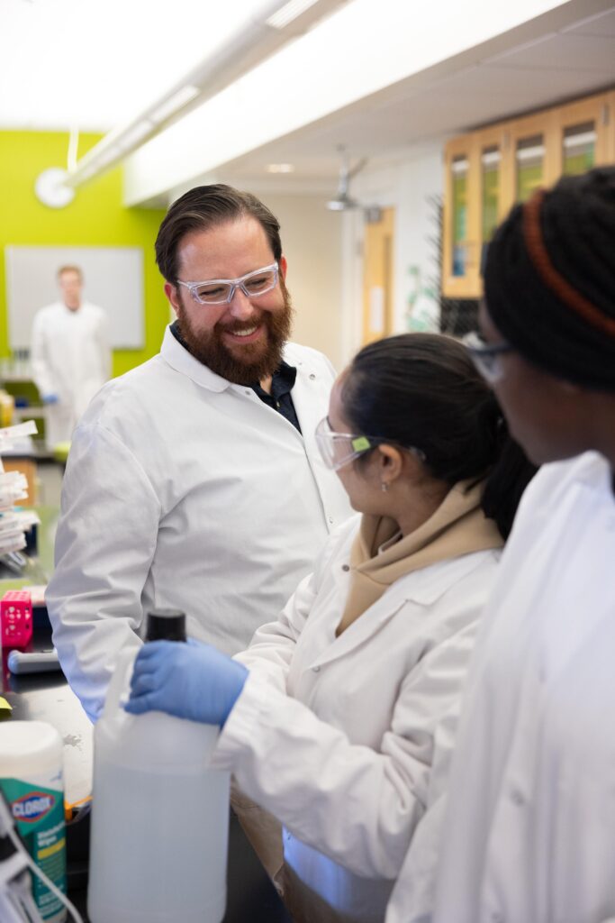 Dr. Tyler Stack with students.