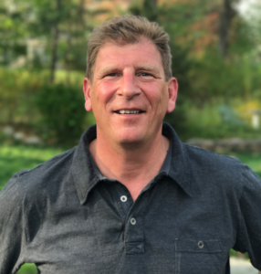 Middle-aged man with short brown hair.