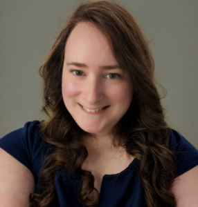 Woman with longer light brown hair.