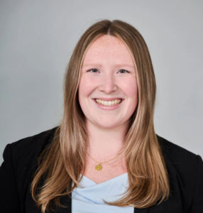 Woman with long redish blond hair.